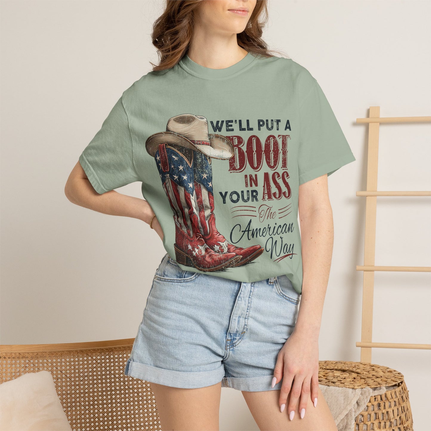 Patriotic Cowboy Boot T-Shirt — "We’ll Put a Boot in Your Ass the American Way"
