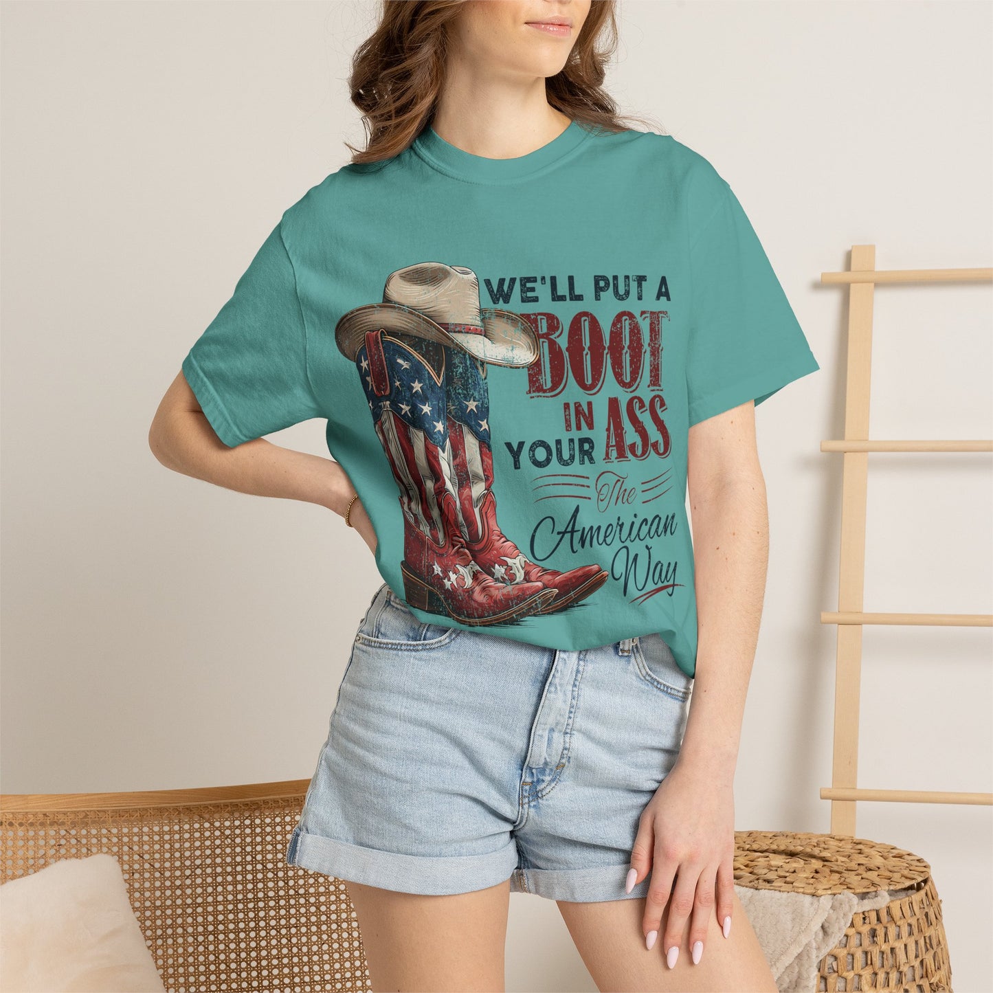 Patriotic Cowboy Boot T-Shirt — "We’ll Put a Boot in Your Ass the American Way"